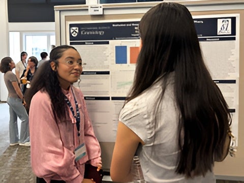 Students presenting and sharing their research findings during a departmental poster session