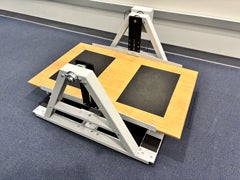Stability platform with digital control featuring a wooden standing board and metal frame in the lab