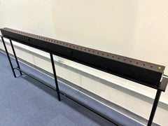 Bassin Anticipation Timer track with red LED lights mounted on a black table